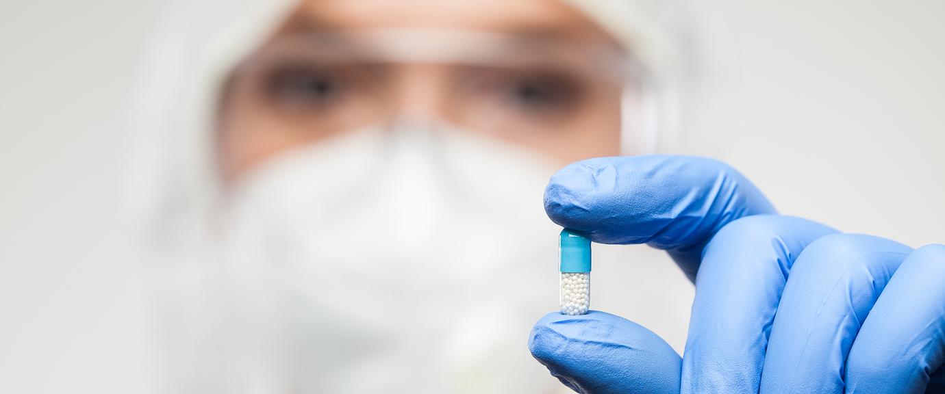 A labaratory operative holding a capsule